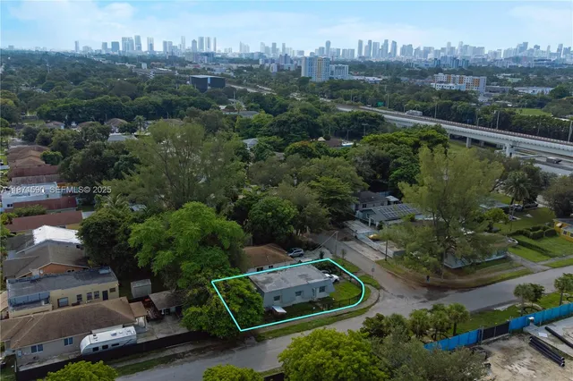 an aerial view of a house with outdoor space