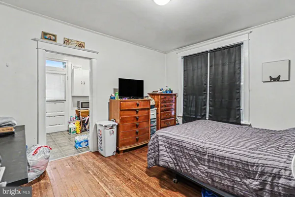 a bedroom with a bed and a flat tv screen