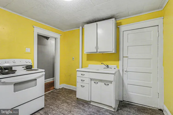 a kitchen with a stove top oven
