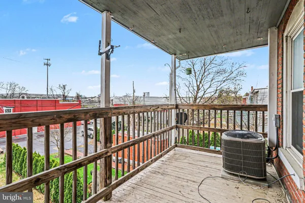 a view of balcony with furniture
