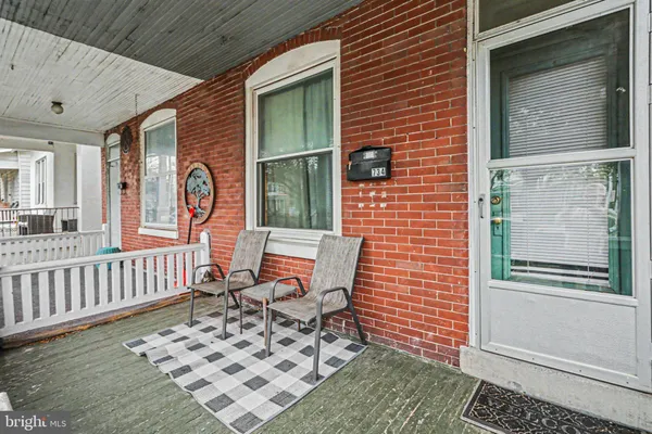 a view of a porch with furniture