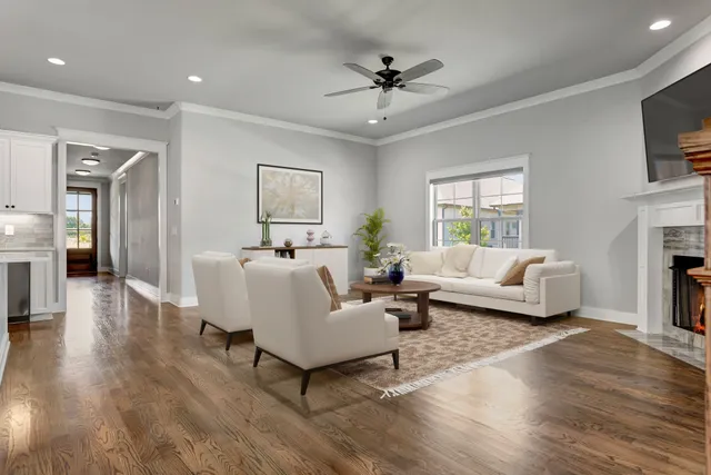 a living room with furniture and a fireplace