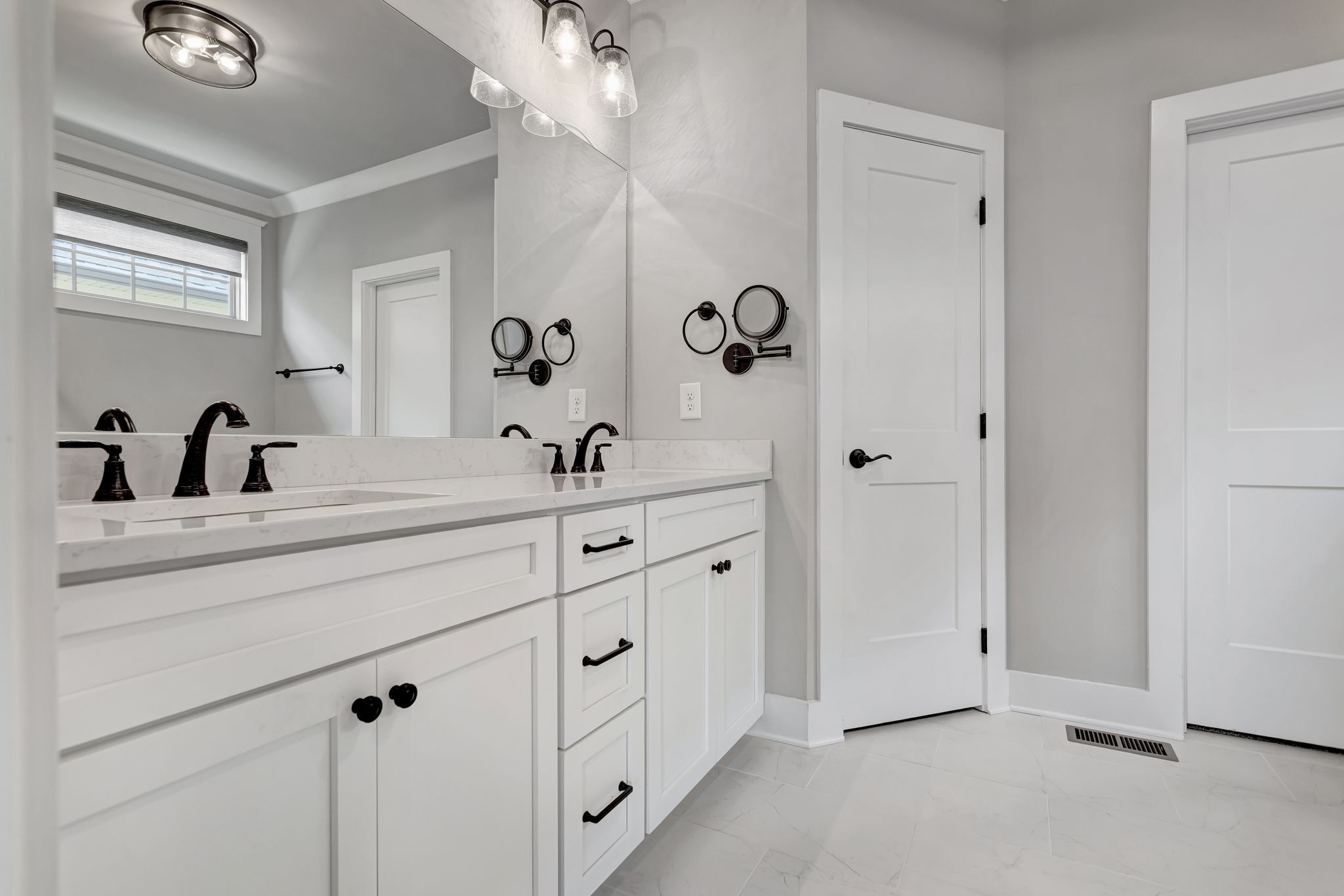 4050 Kiskadee Ln Spring Hill Spring Hill, TN 37174 - Photo 23 of 36 a bathroom with a double vanity sink a mirror and shower