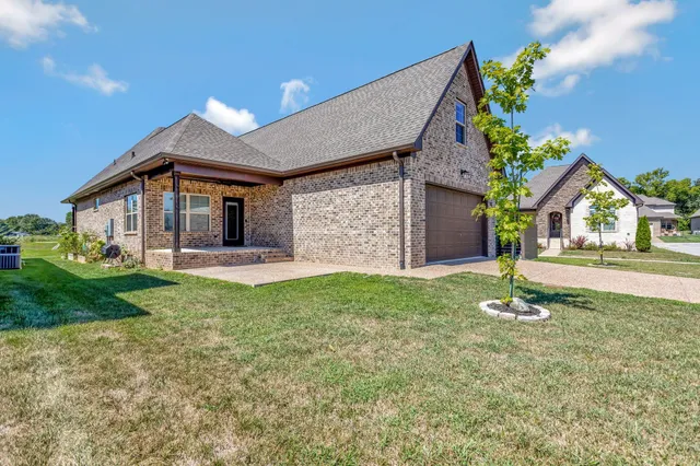 a backyard of a house with lots of green space