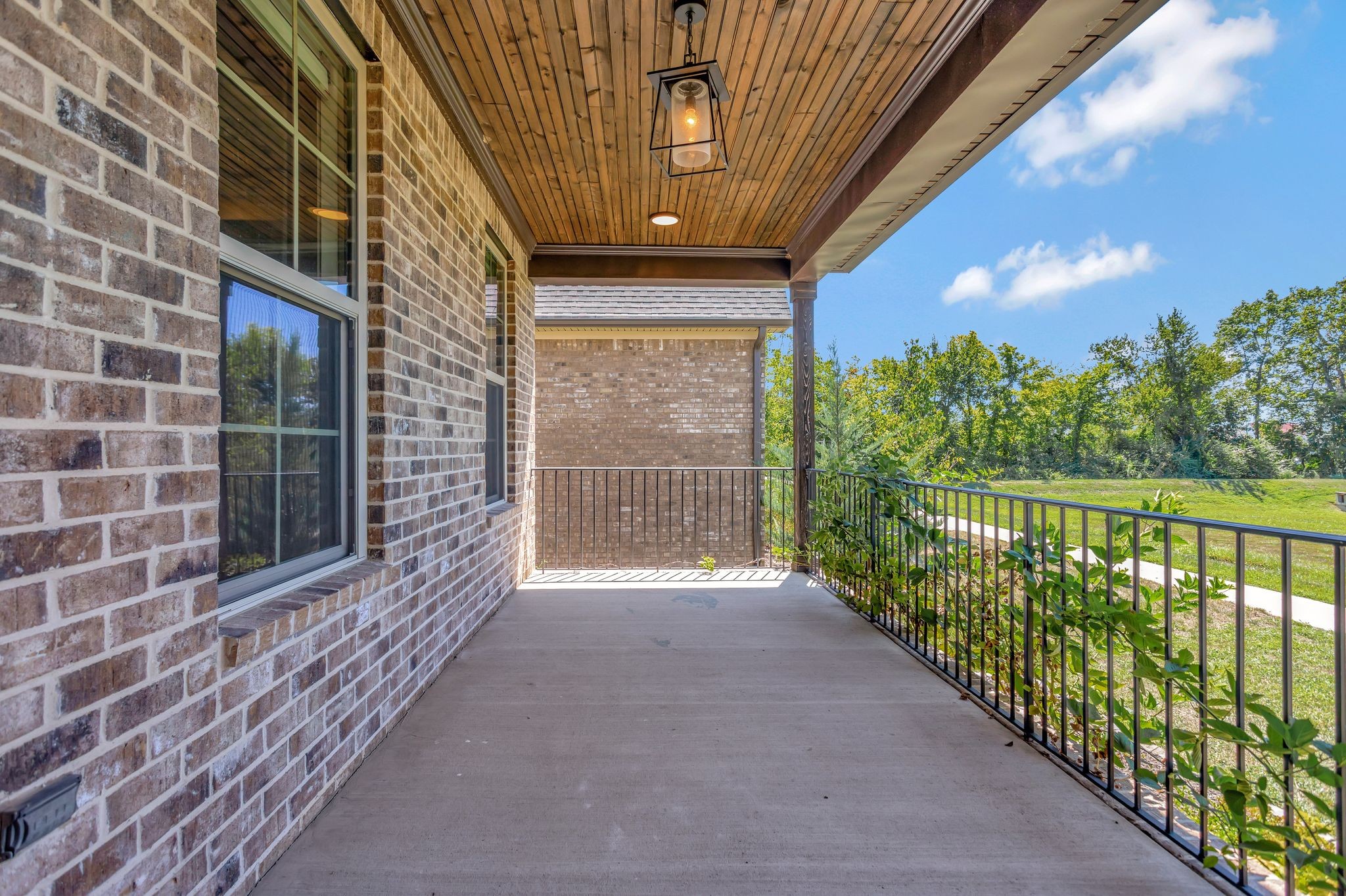 4050 Kiskadee Ln Spring Hill Spring Hill, TN 37174 - Photo 4 of 36 a view of a porch with wooden floor and fence
