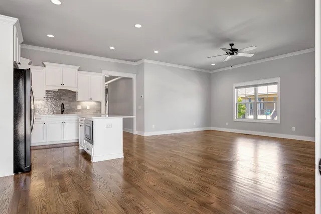 a view of kitchen with furniture and a ceiling fan