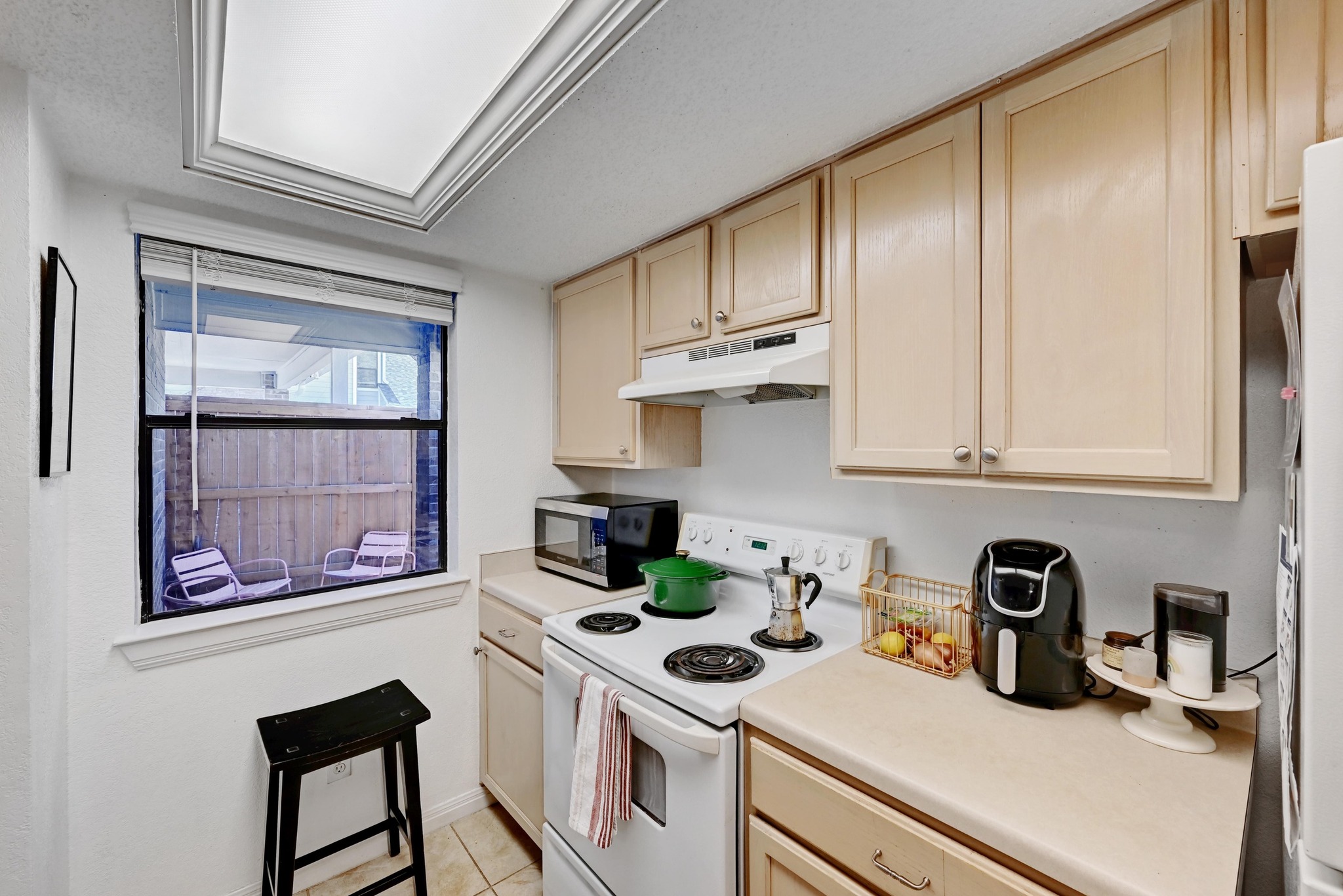 7635 Guadalupe Street, Unit 1002 Austin, TX 78752 - Photo 13 of 27 a kitchen with stainless steel appliances a stove a refrigerator a sink and cabinets