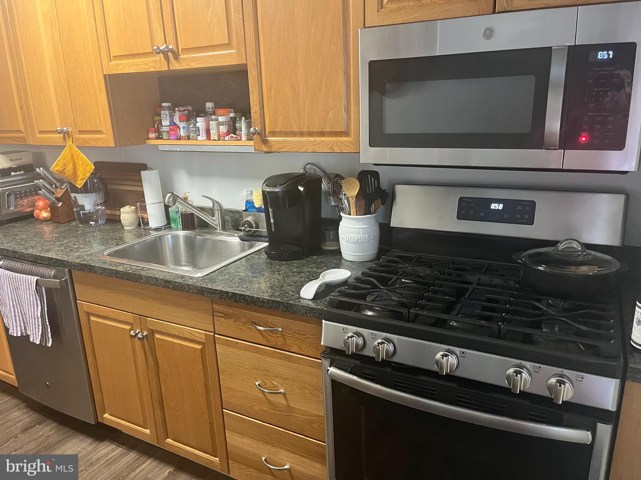 1658 Thetford Road Towson, MD 21286 - Photo 4 of 7 a kitchen with a stove and a microwave
