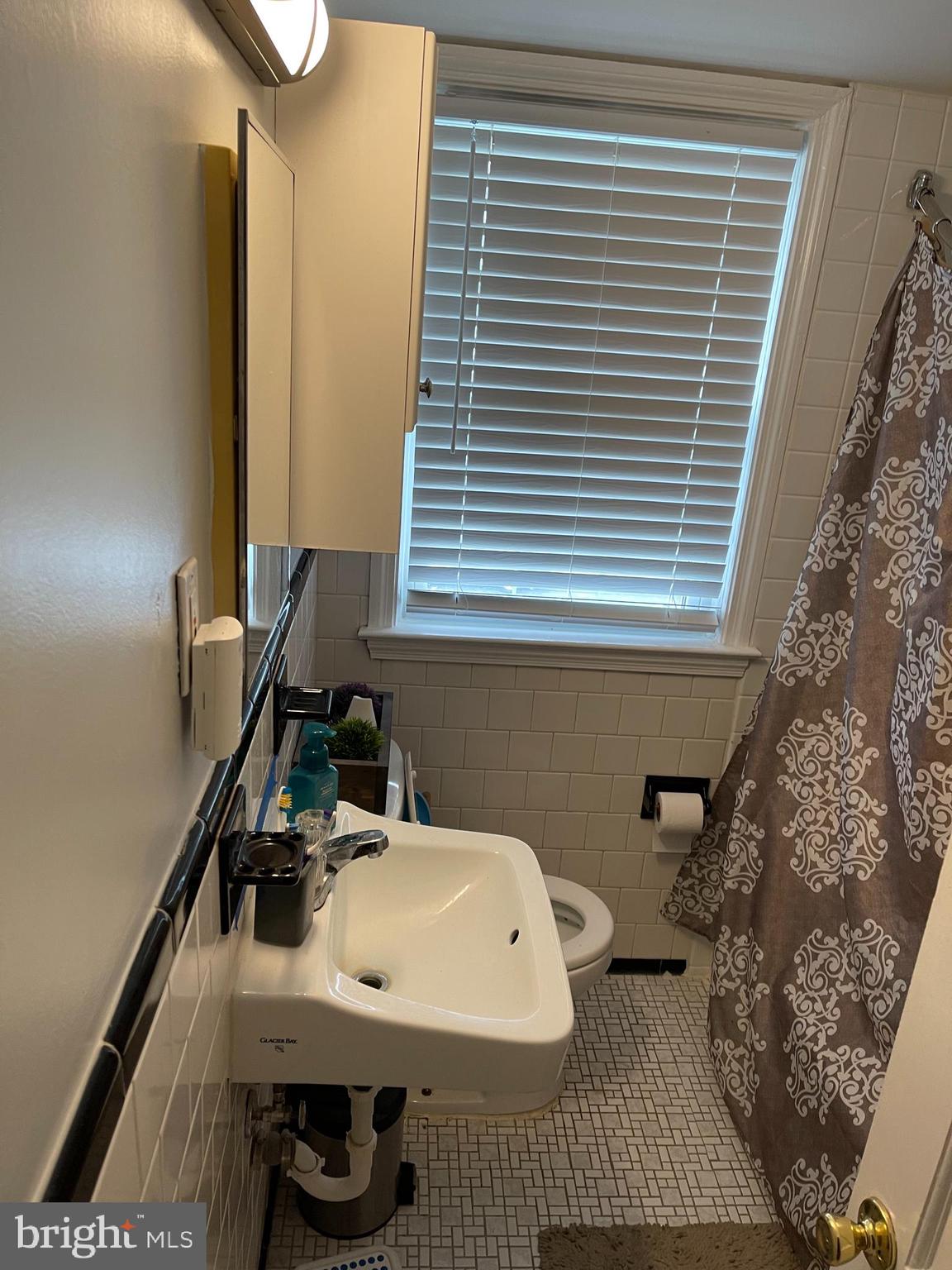 1658 Thetford Road Towson, MD 21286 - Photo 7 of 7 a bathroom with a sink and a toilet