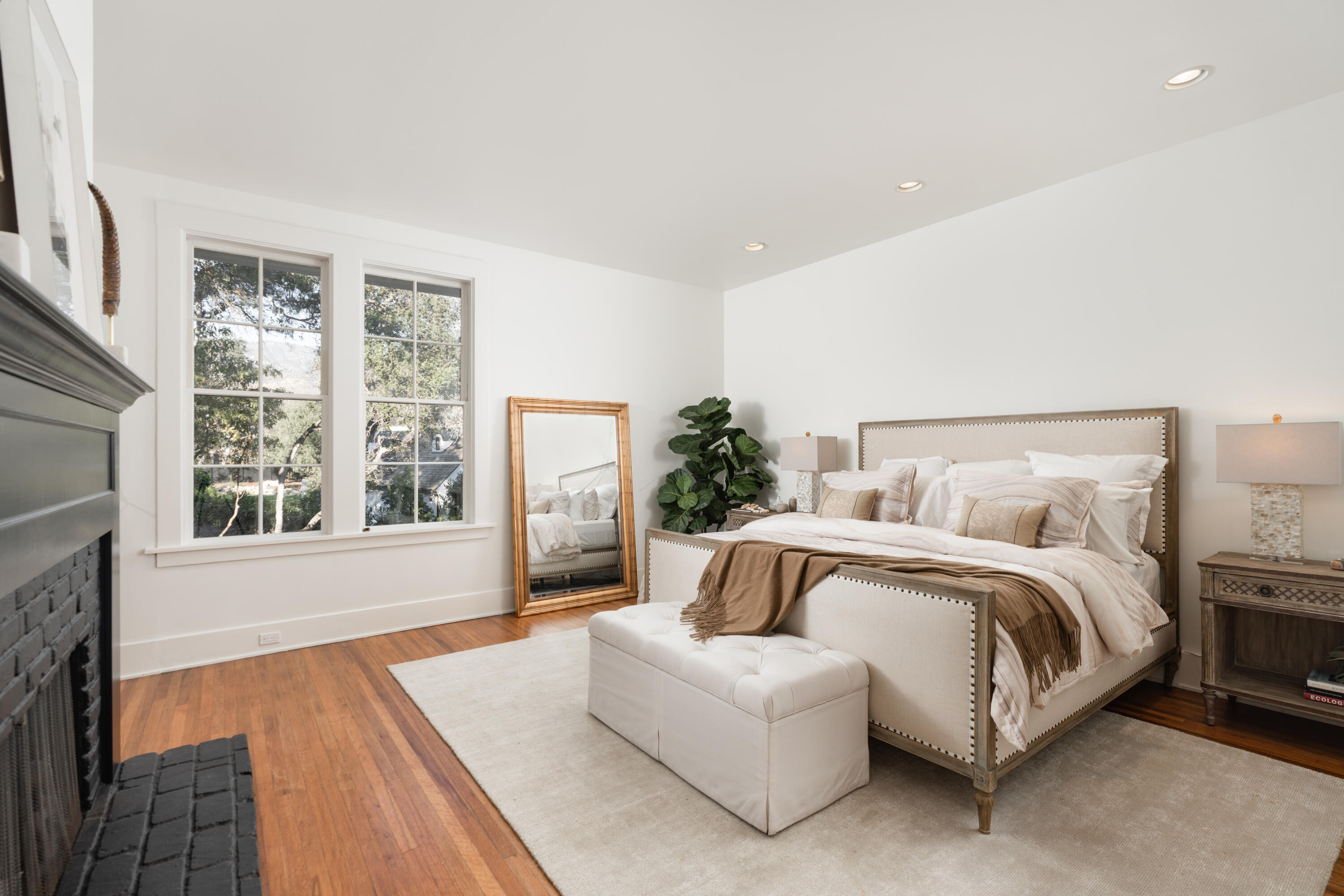 200 Olive Mill Road Montecito, CA 93108 - Photo 20 of 33 a spacious bedroom with a bed and a large window