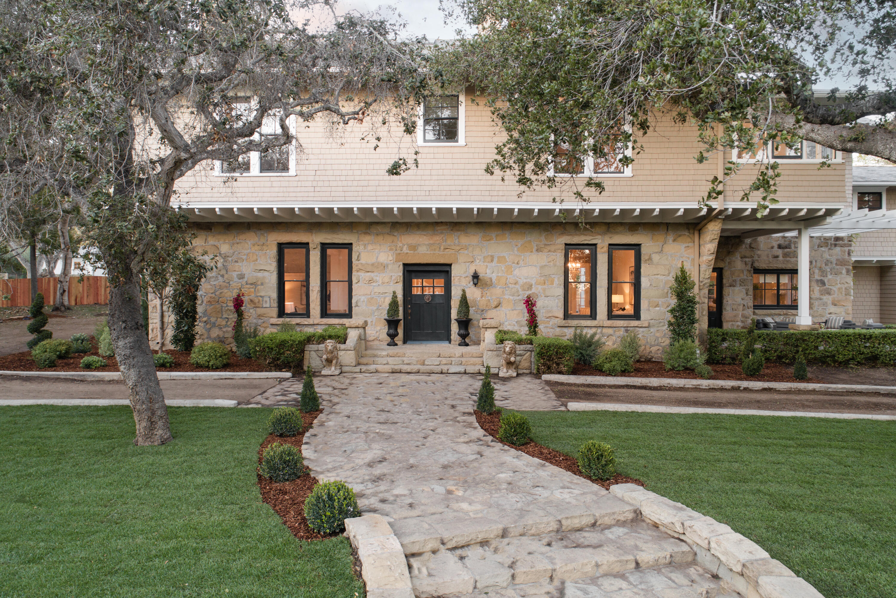 200 Olive Mill Road Montecito, CA 93108 - Photo 3 of 33 a front view of a house with a yard and trees