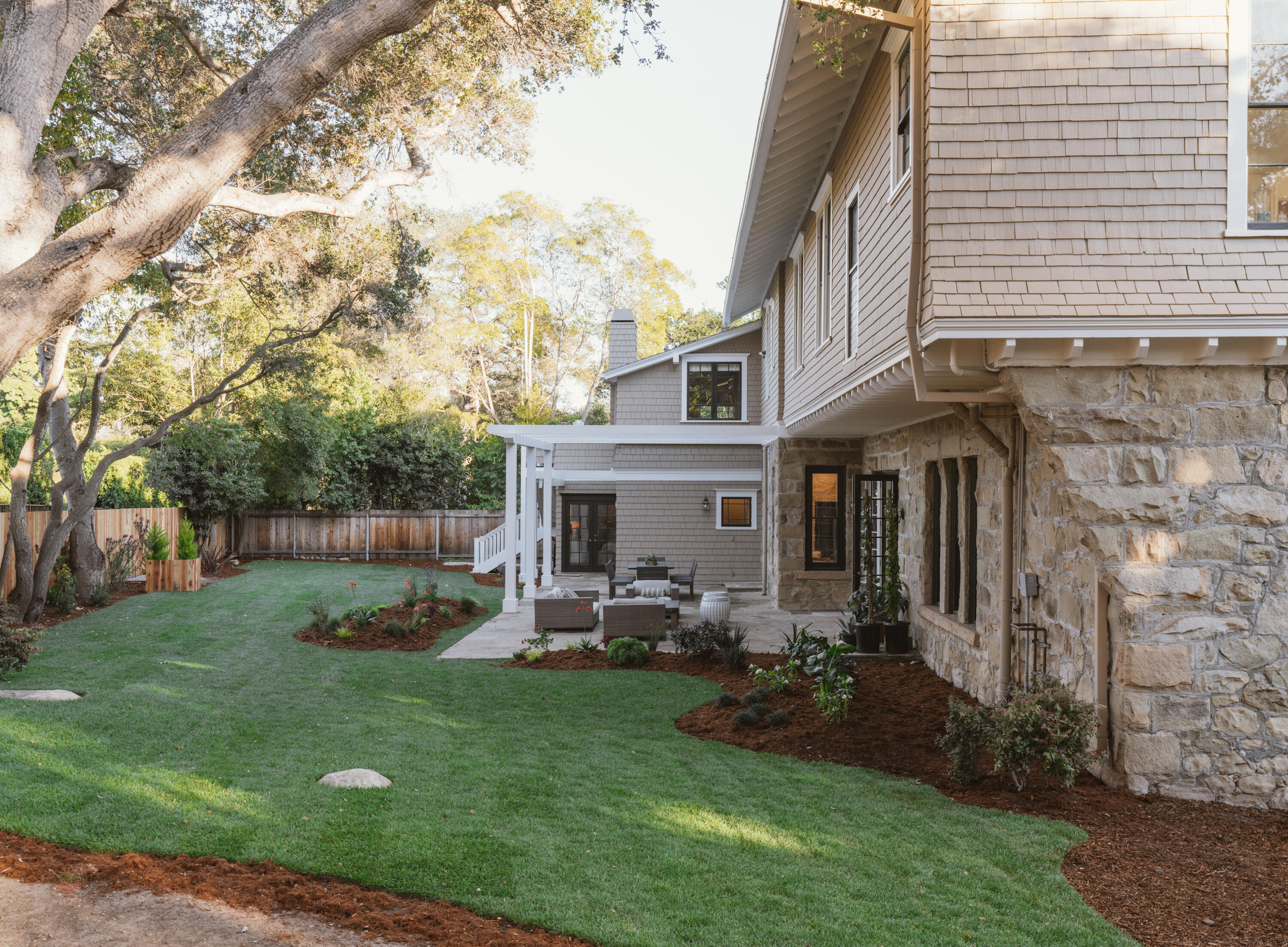 200 Olive Mill Road Montecito, CA 93108 - Photo 33 of 33 a backyard of a house with table and chairs