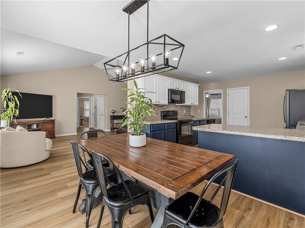 2520 Linmar Circle Anderson, SC 29621 - Photo 15 of 50 An open-concept living space integrates a stylish dining area with a well-appointed kitchen.