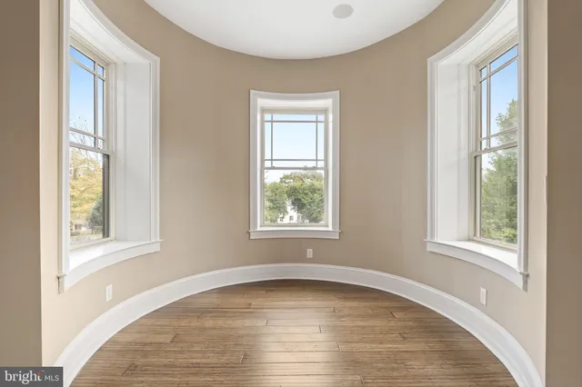 a large kitchen with a table and chairs
