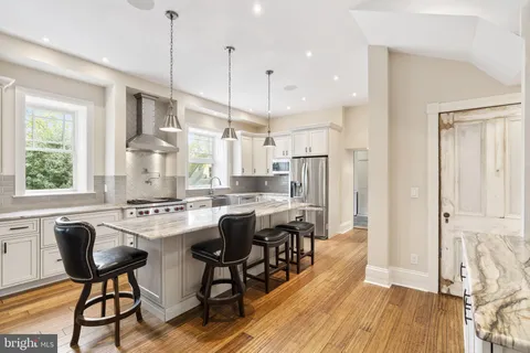 a bathroom with a toilet a sink and a mirror