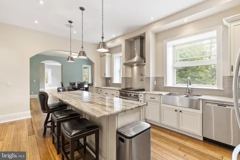 a view of an entryway with wooden floor