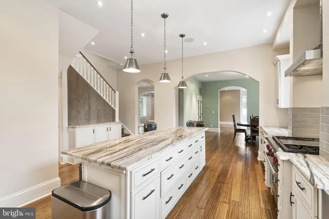 a view of a dining room with furniture wooden floor and a chandelier