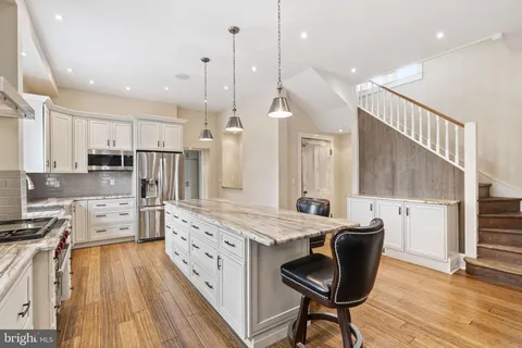 a view of an entryway with wooden floor
