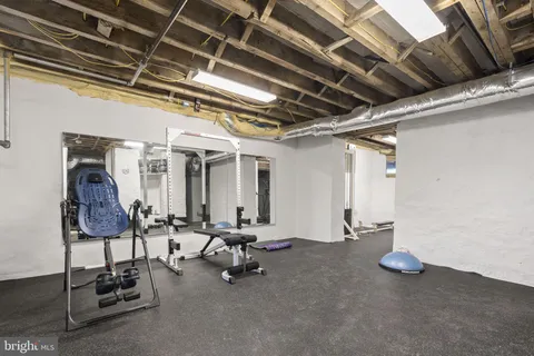 a bathroom with a granite countertop bathtub shower sink vanity and toilet