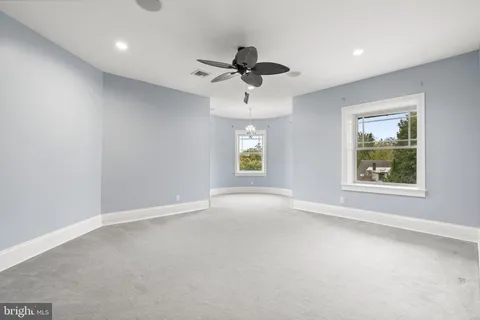 a front view of a house with trees