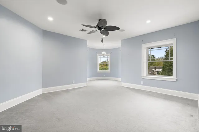 a front view of a house with trees