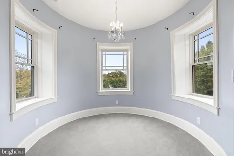 a patio view with a table and chairs