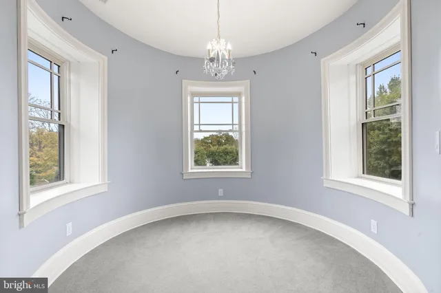 a patio view with a table and chairs