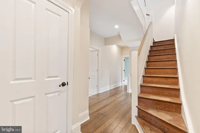 a view of a deck with table and chairs a barbeque with wooden floor and fence