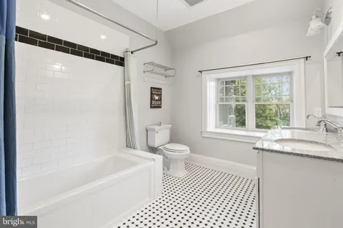 an aerial view of a house with outdoor space lake house swimming pool and outdoor space