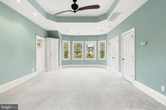 a front view of a house with a fountain