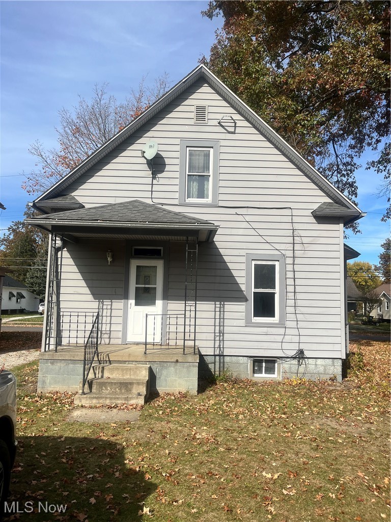 232 Selby Street Alliance, OH 44601 - Photo 2 of 15 Rear view of house with covered porch and roof with shingles