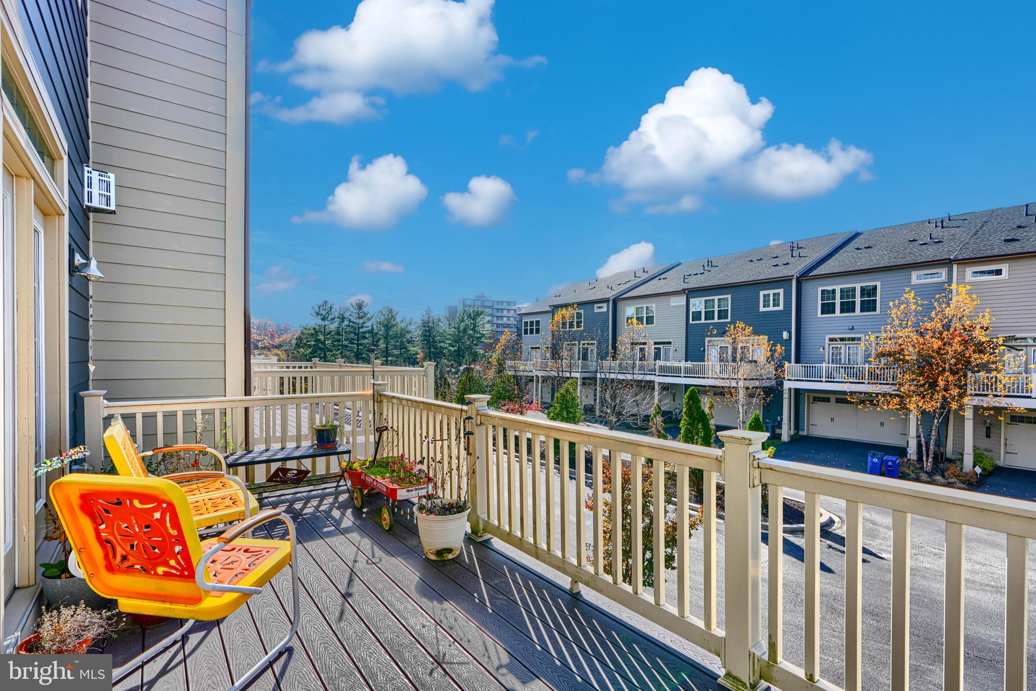 30 Wedge Way, Unit 12 Baltimore, MD 21208 - Photo 19 of 42 a view of a chair and tables in the balcony