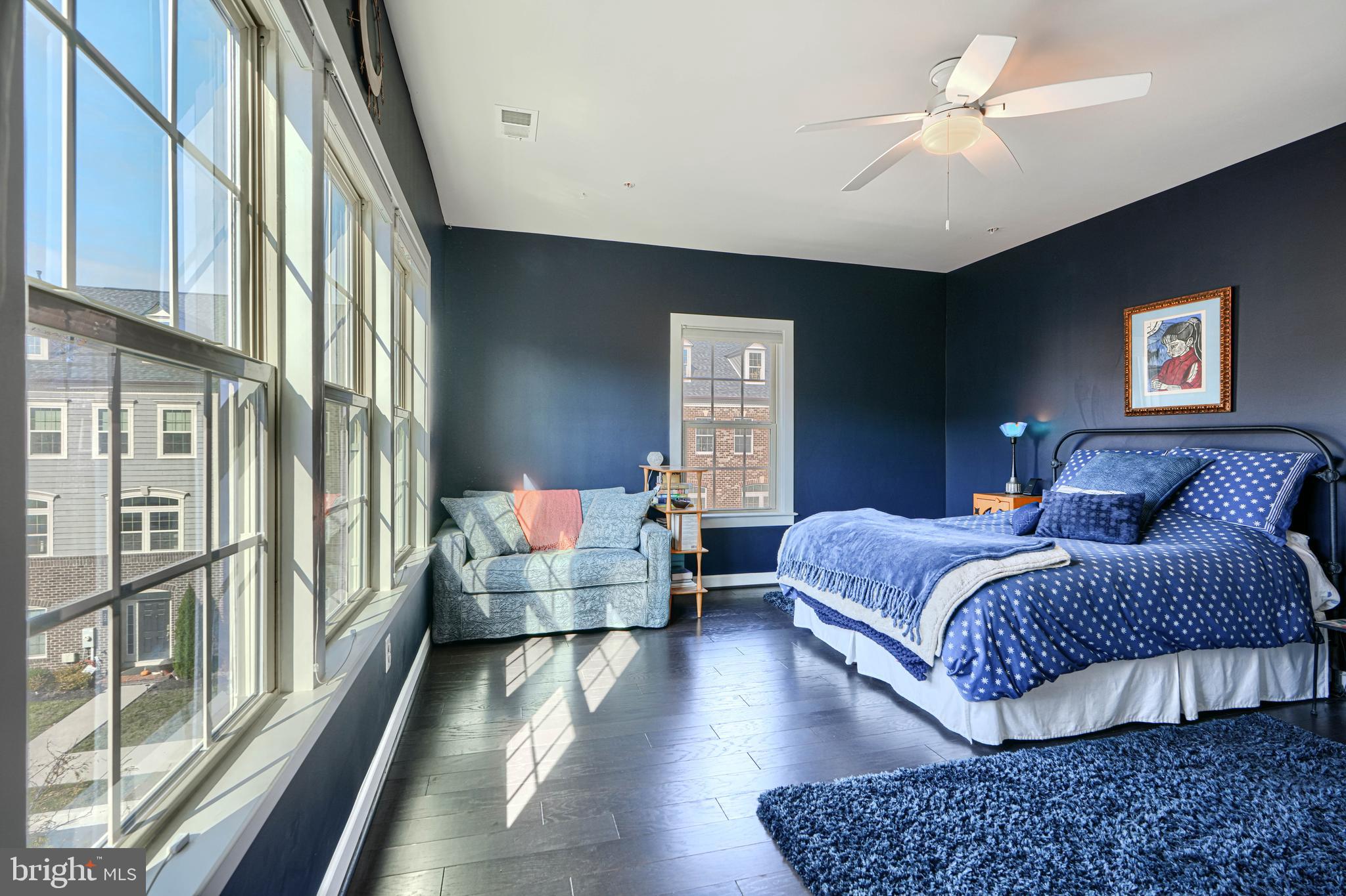 30 Wedge Way, Unit 12 Baltimore, MD 21208 - Photo 25 of 42 a spacious bedroom with a bed couch and a window