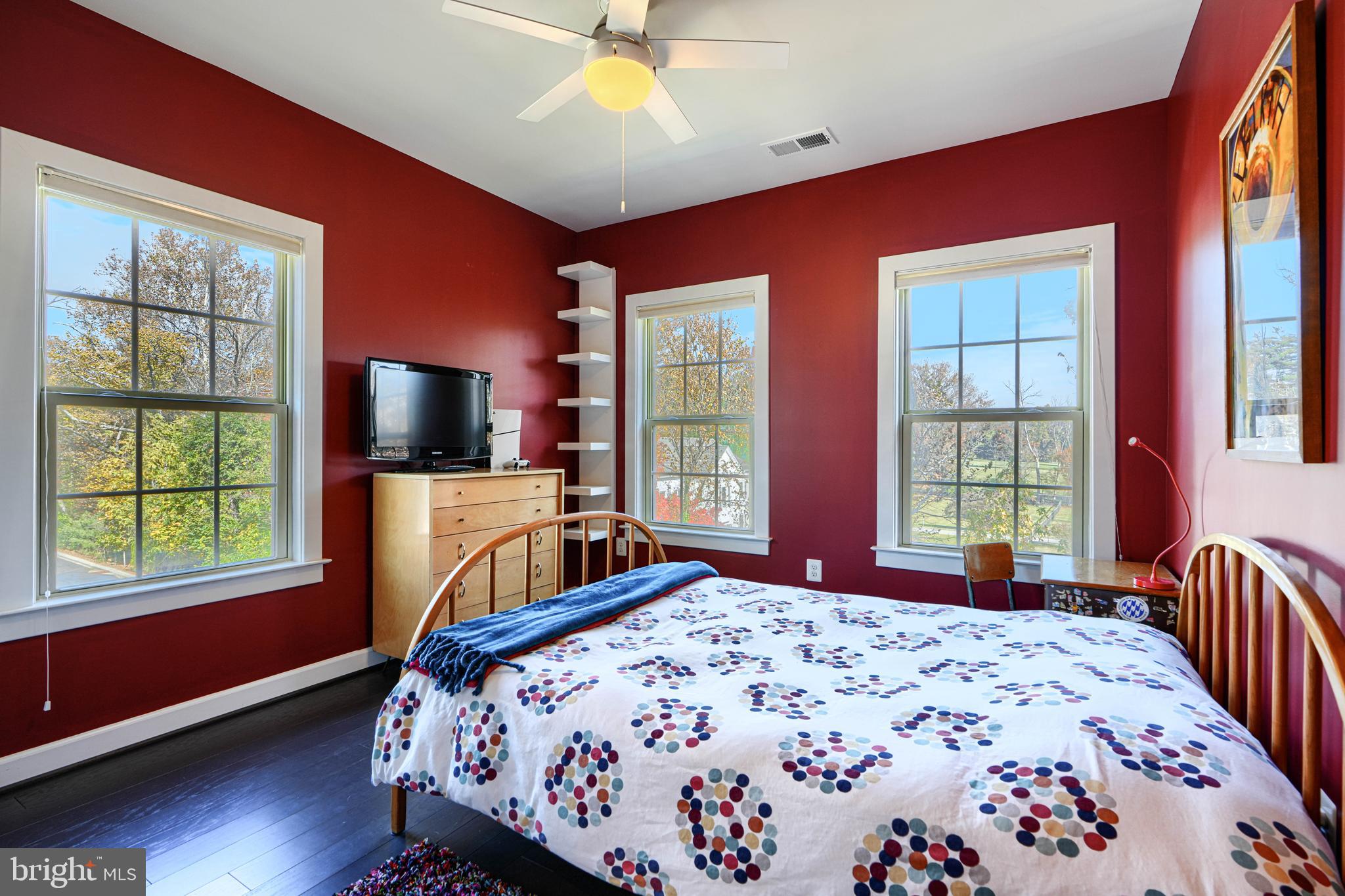 30 Wedge Way, Unit 12 Baltimore, MD 21208 - Photo 30 of 42 a bedroom with a bed and a flat screen tv