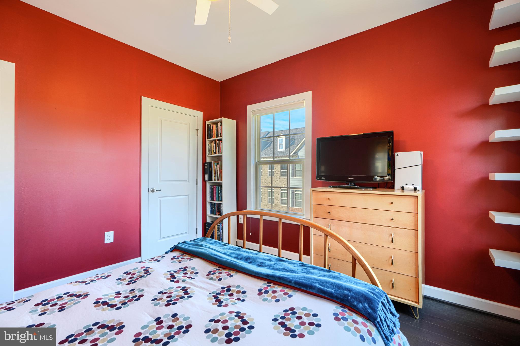 30 Wedge Way, Unit 12 Baltimore, MD 21208 - Photo 32 of 42 a bedroom with a bed and a flat screen tv