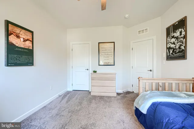 a bed room with a bed and a window