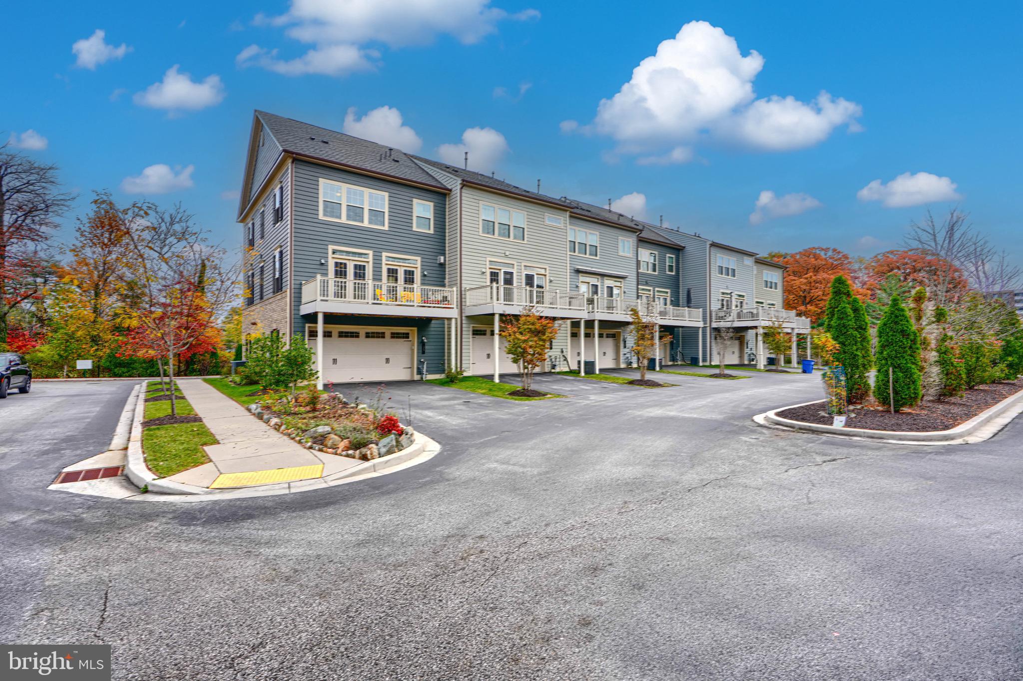 30 Wedge Way, Unit 12 Baltimore, MD 21208 - Photo 5 of 42 a view of an house with backyard and fire pit