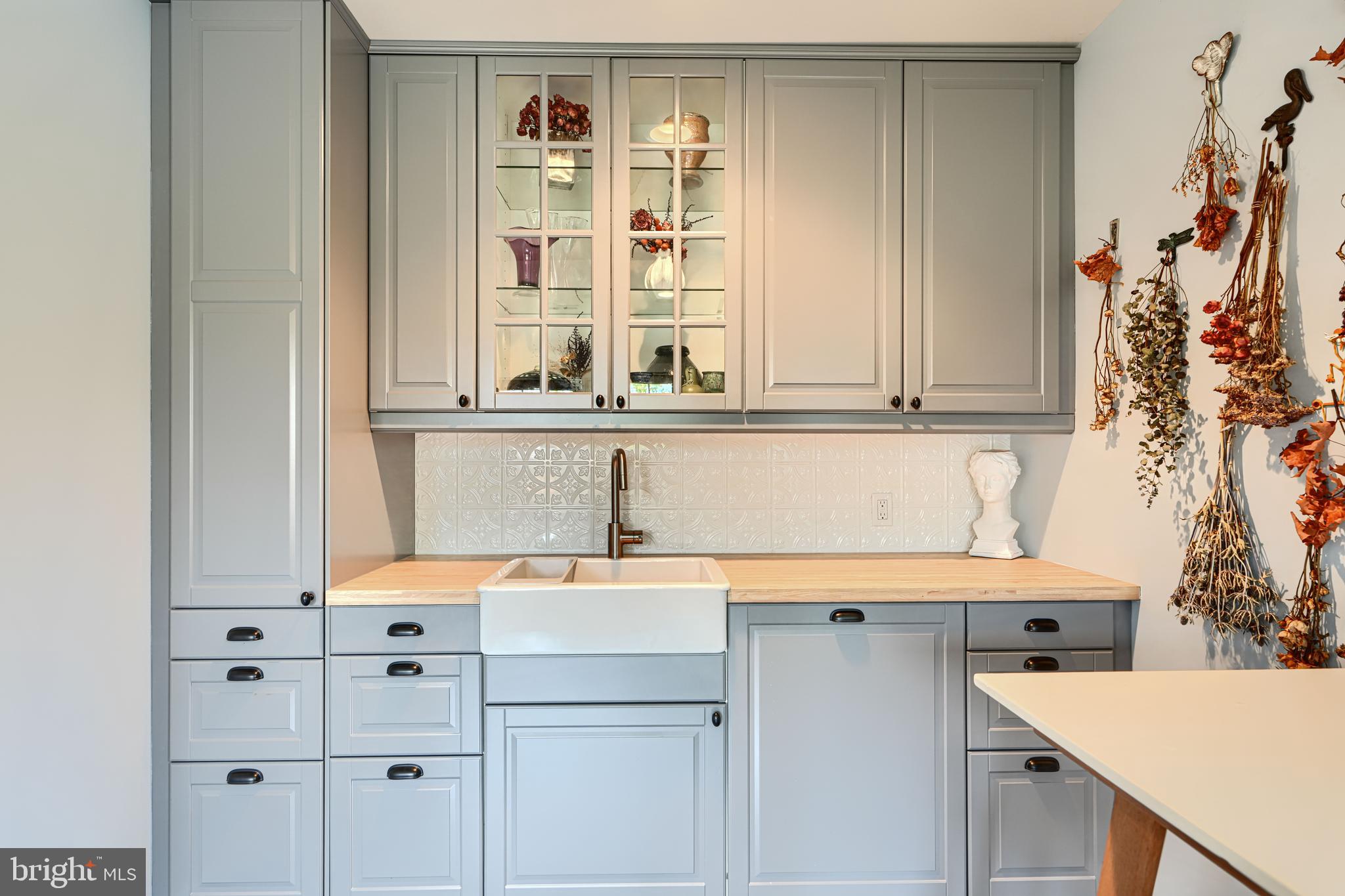 30 Wedge Way, Unit 12 Baltimore, MD 21208 - Photo 10 of 42 a view of cabinets with wooden floor and white cabinets