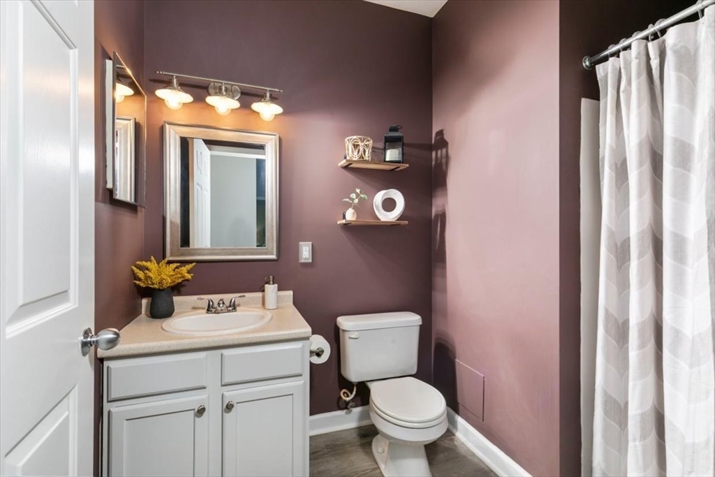 23 Hampshire Road, Unit 108 Methuen, MA 01844 - Photo 23 of 39 a bathroom with a toilet sink and mirror