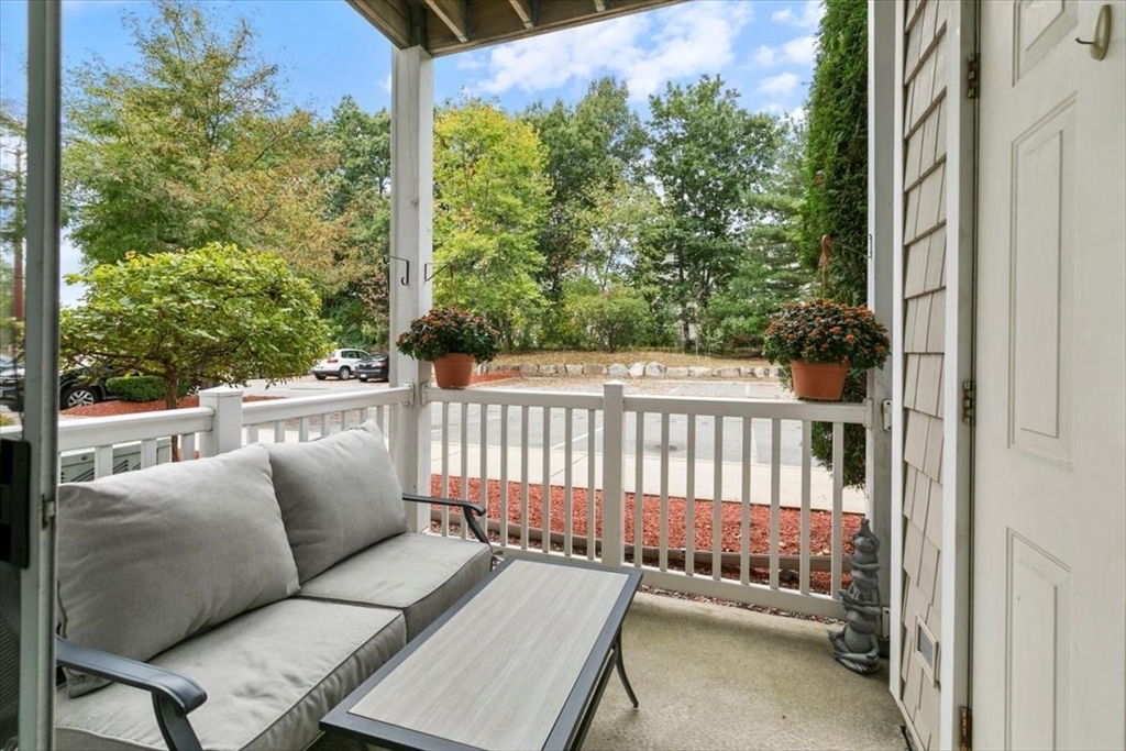 23 Hampshire Road, Unit 108 Methuen, MA 01844 - Photo 26 of 39 a balcony with wooden floor