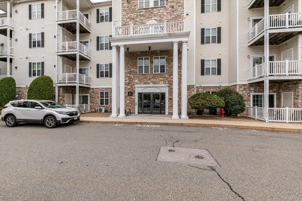 23 Hampshire Road, Unit 108 Methuen, MA 01844 - Photo 35 of 39 front view of a building with a street