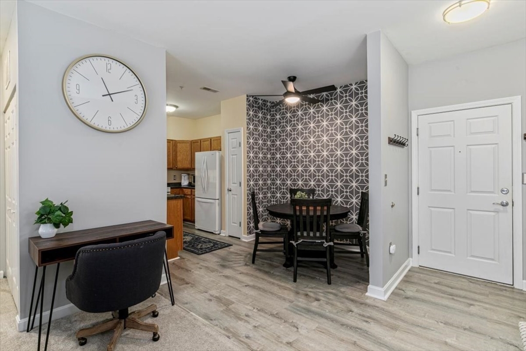 23 Hampshire Road, Unit 108 Methuen, MA 01844 - Photo 9 of 39 a view of a livingroom with furniture and wooden floor