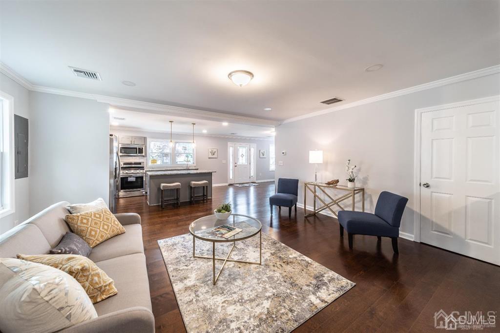 107 Winthrop Road Edison, NJ 08817 - Photo 11 of 38 a living room with furniture and wooden floor