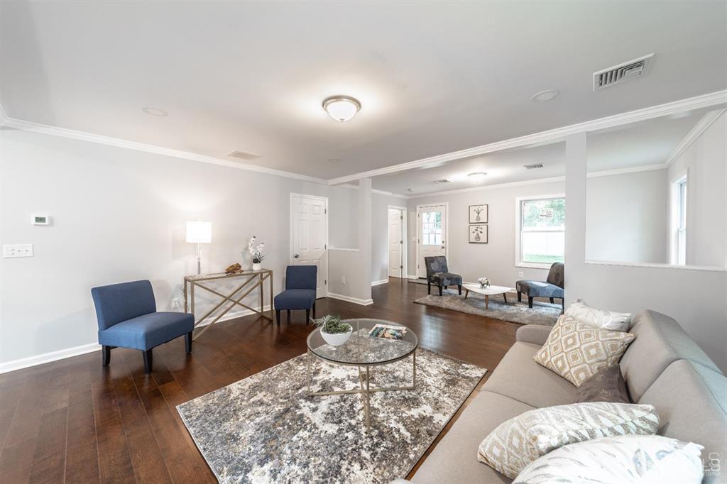 107 Winthrop Road Edison, NJ 08817 - Photo 13 of 38 a living room with furniture and wooden floor