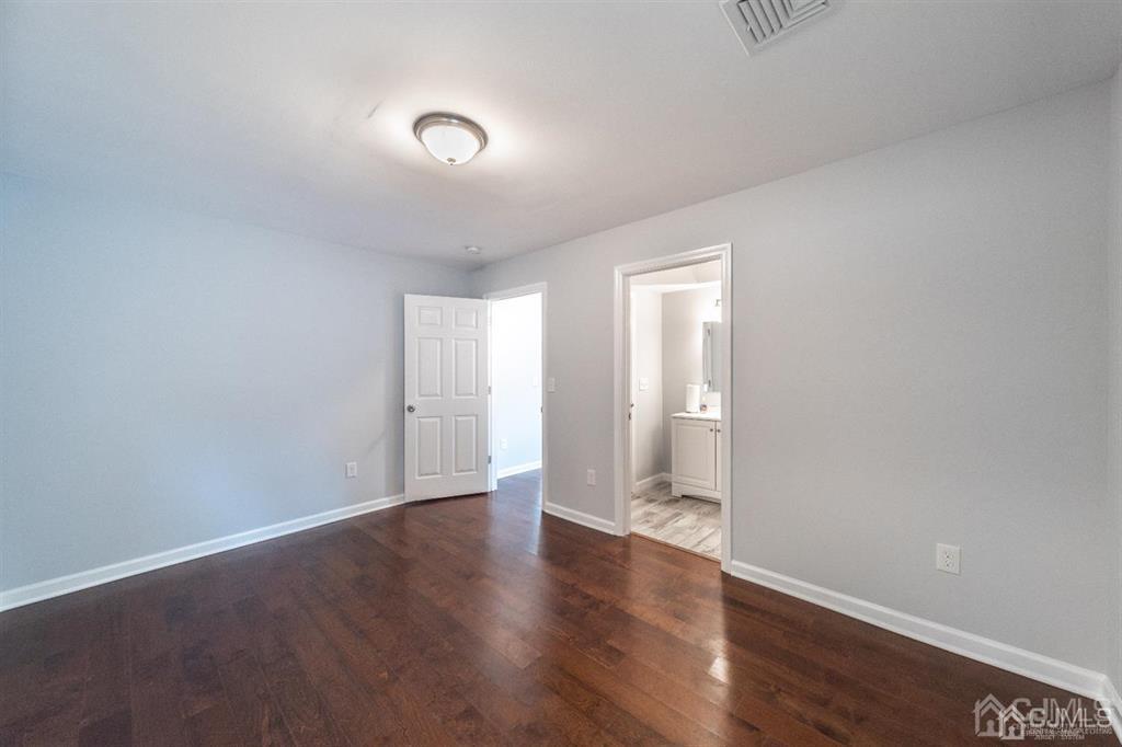 107 Winthrop Road Edison, NJ 08817 - Photo 17 of 38 a view of an empty room with wooden floor