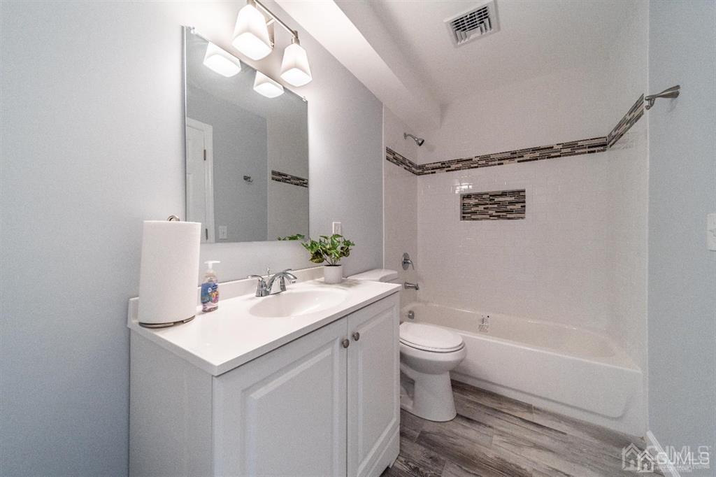 107 Winthrop Road Edison, NJ 08817 - Photo 20 of 38 a bathroom with a sink a toilet and shower