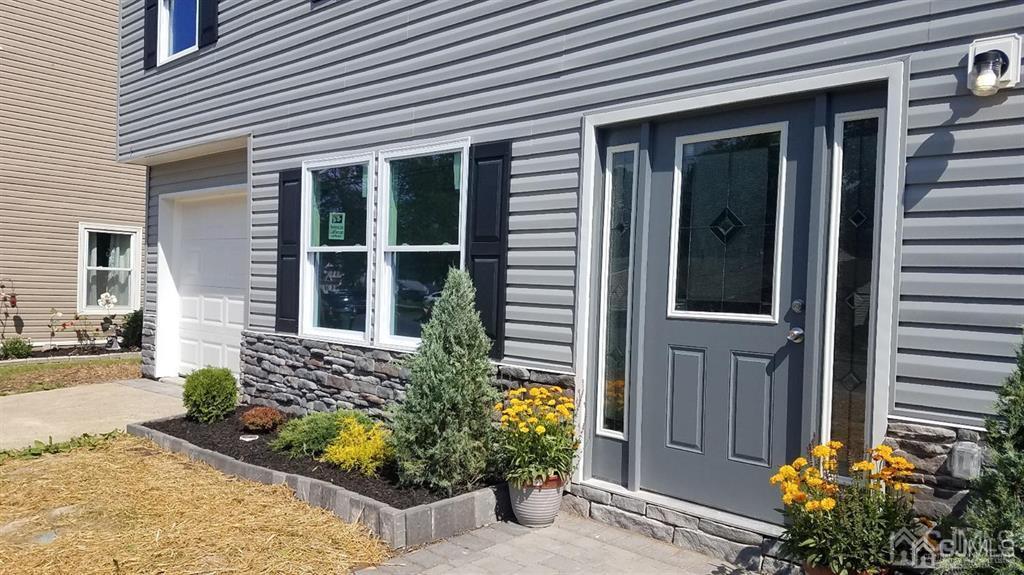 107 Winthrop Road Edison, NJ 08817 - Photo 2 of 38 a front view of a house with a garden