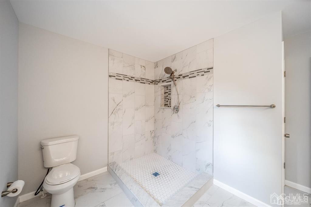 107 Winthrop Road Edison, NJ 08817 - Photo 29 of 38 a bathroom with a shower and a toilet
