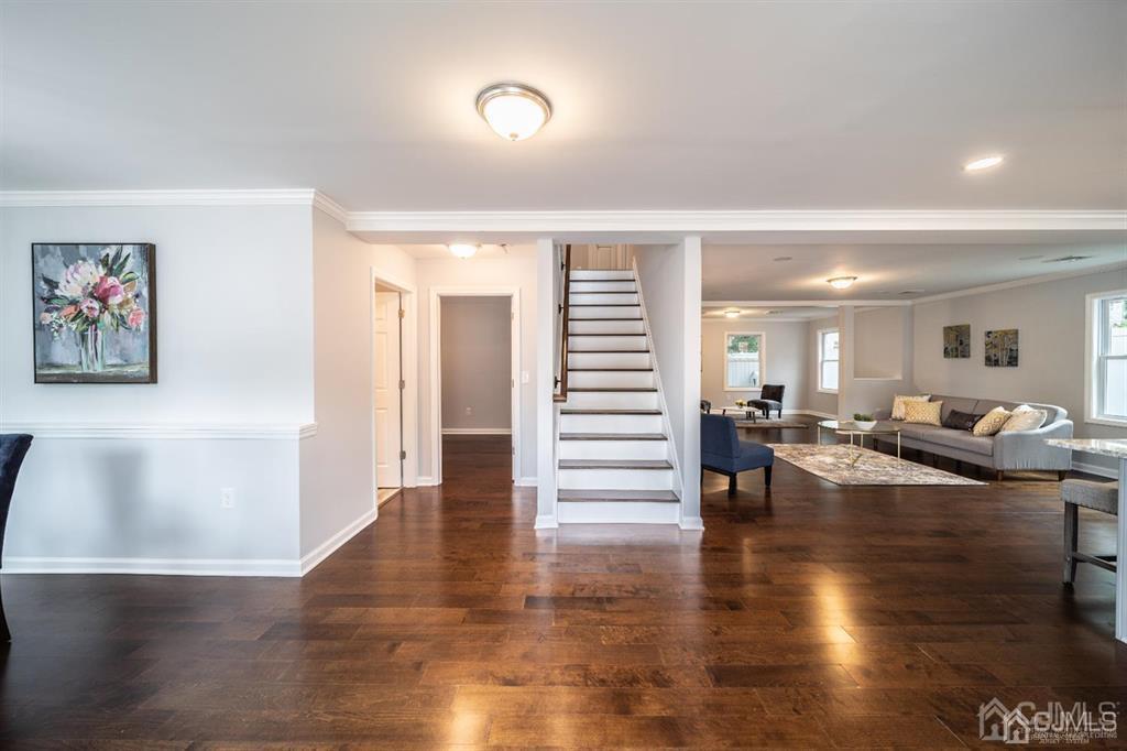 107 Winthrop Road Edison, NJ 08817 - Photo 3 of 38 a hall with lots of furniture and wooden floor