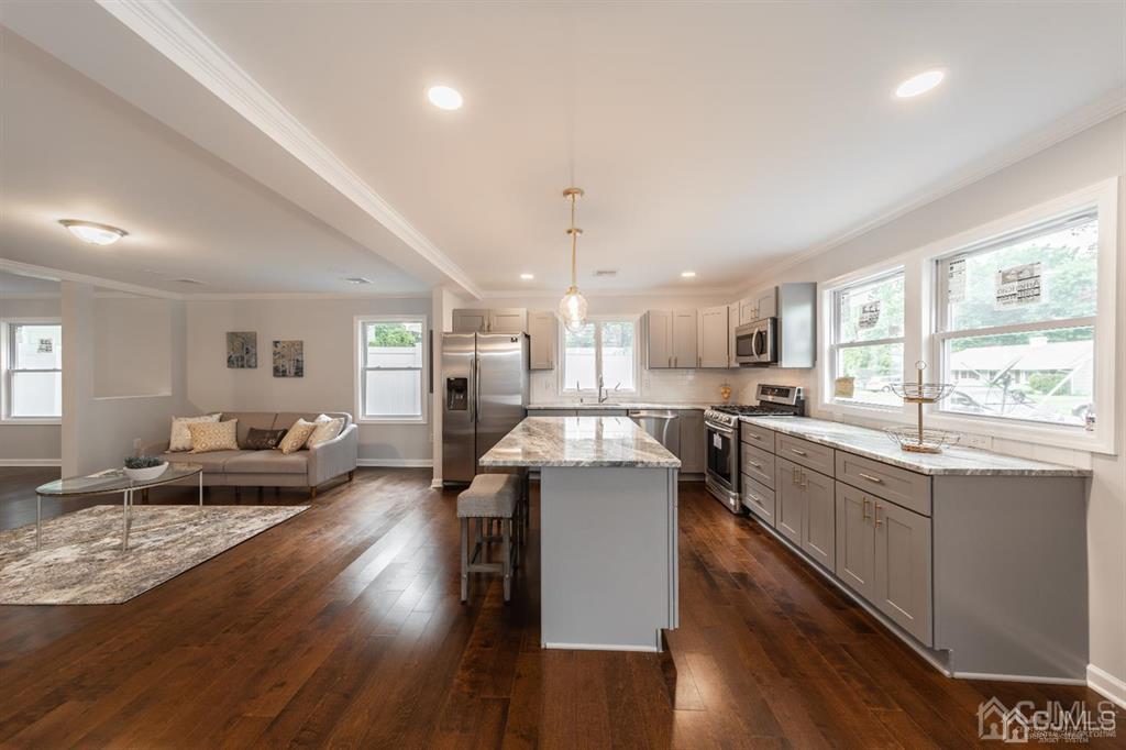 107 Winthrop Road Edison, NJ 08817 - Photo 7 of 38 a large white kitchen with lots of counter space a sink and appliances
